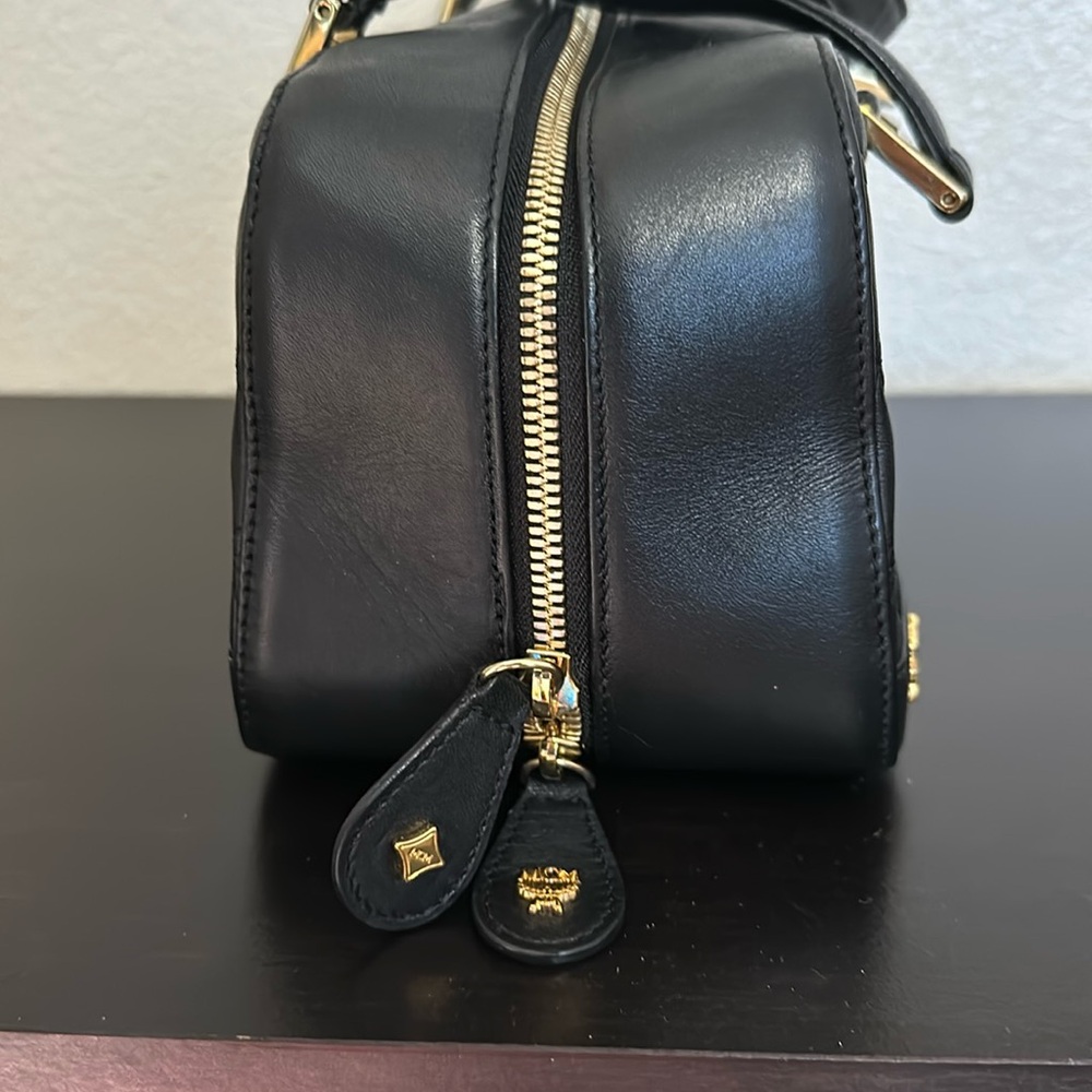 MCM black leather handbag .